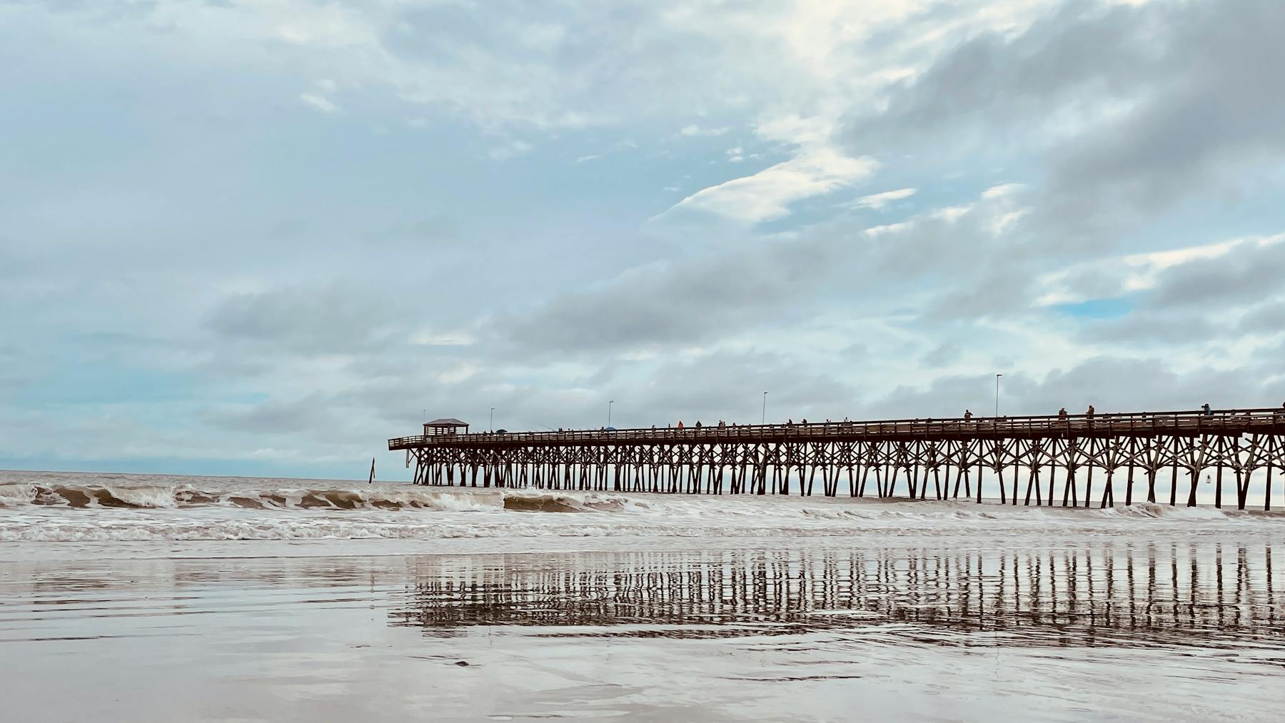 Quiet beach pier and shoreline